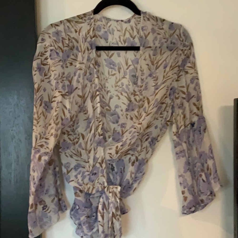 Very feminine cut and print wrap around blouse